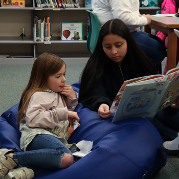 MVHS student reads to younger student
