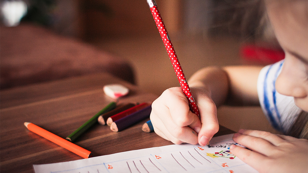 Image of homeschooled girl writing